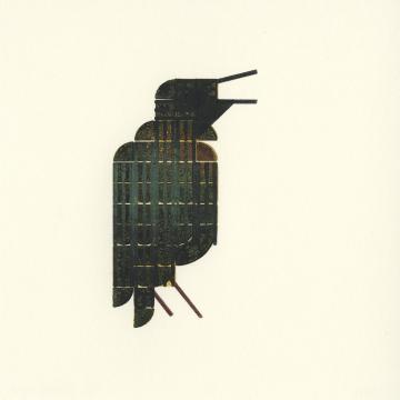 A dark but multicolored bird, sitting upright, singing with open beak.